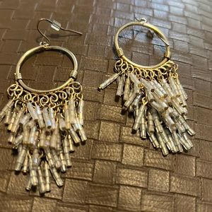 Gold colored pierced earrings. Dangling beads